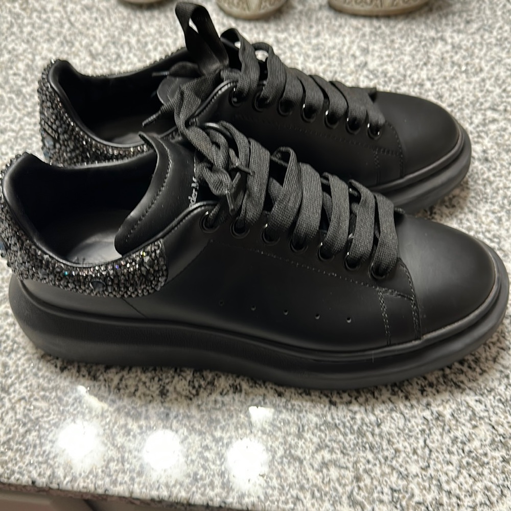 All black Alexander McQueen’s with studs